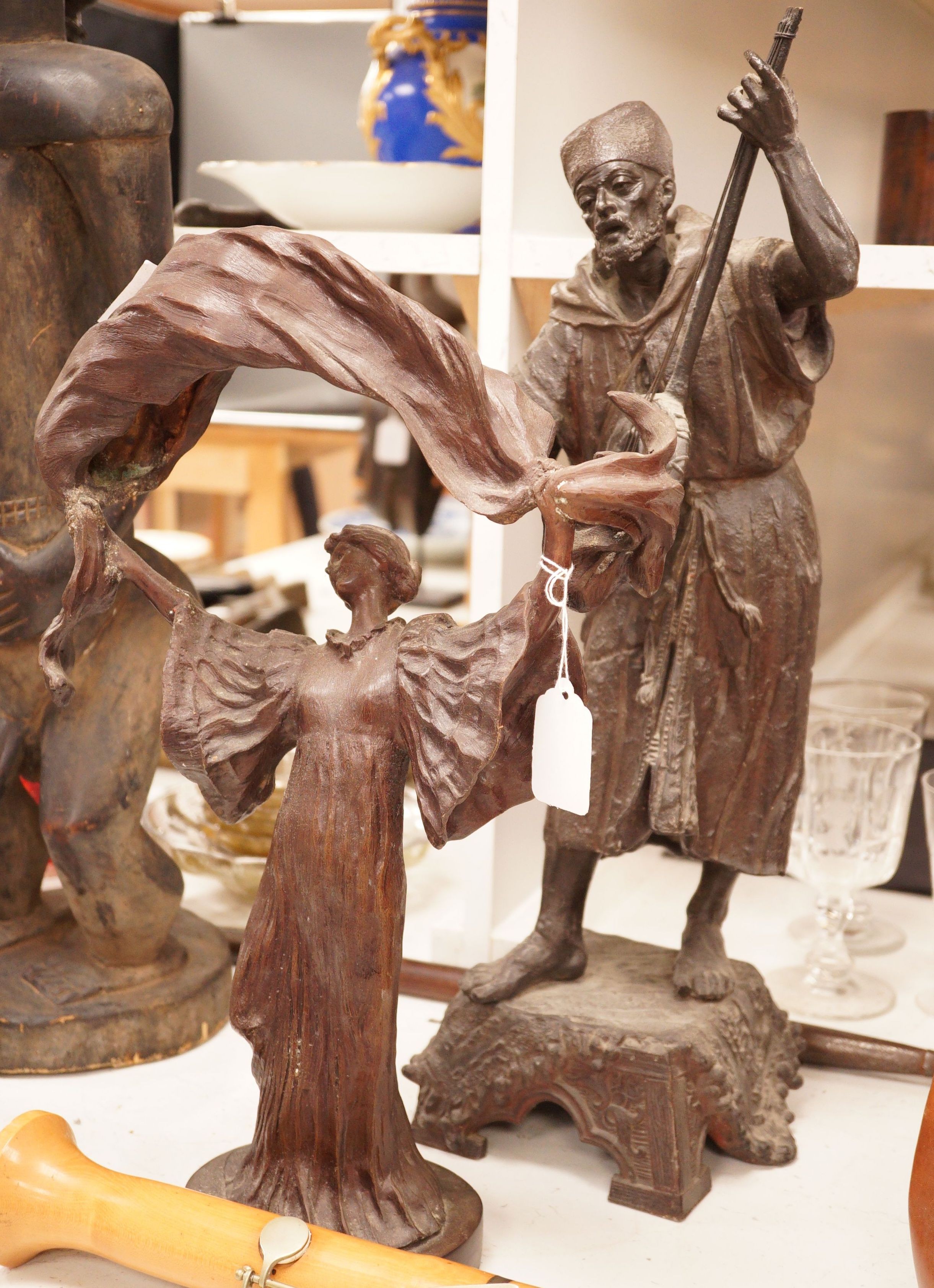 A large spelter figure of an eastern musician together with a bronze of a lady, tallest 58cm